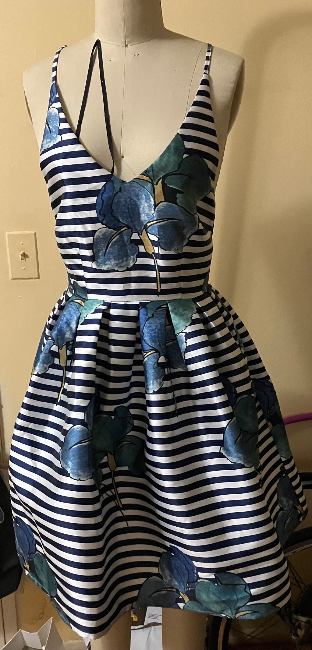 Navy stripe floral appliqué fit and flare dress, size small, displayed on a dress form